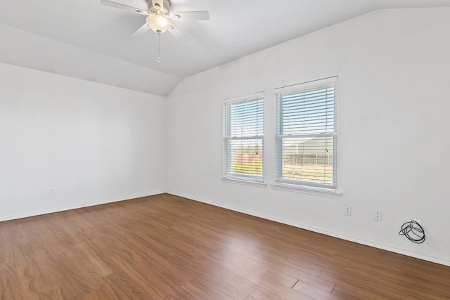 spare room with ceiling fan, lofted ceiling, and hardwood / wood-style flooring