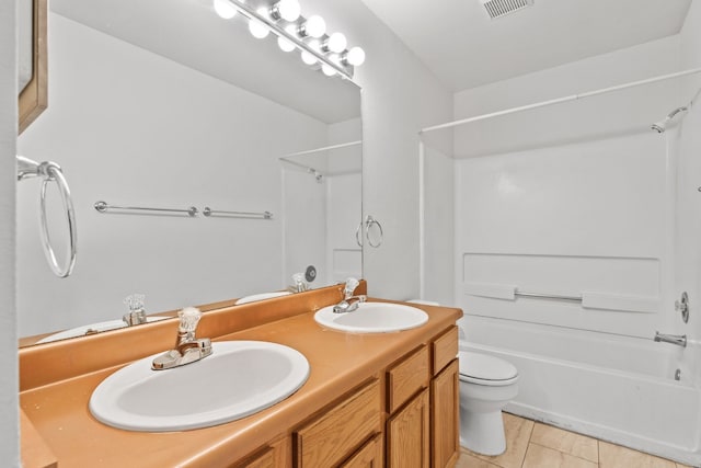 full bathroom with tile patterned flooring, shower / bathing tub combination, vanity, and toilet