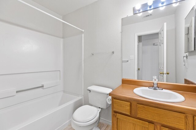 full bathroom featuring vanity, toilet, and bathing tub / shower combination