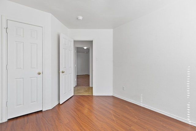 unfurnished bedroom featuring hardwood / wood-style flooring