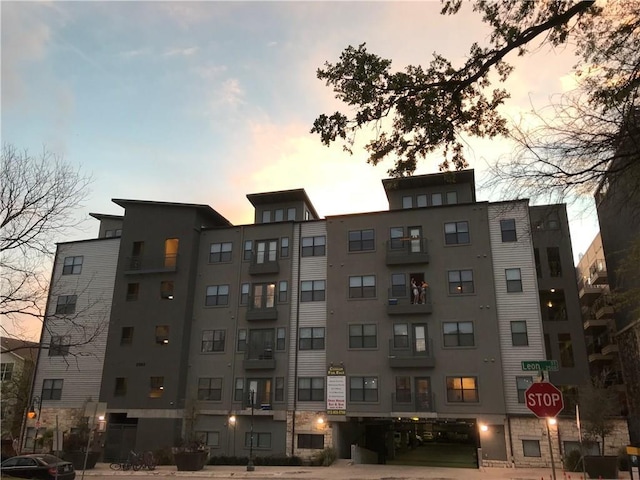 view of outdoor building at dusk