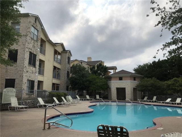 view of pool featuring a patio