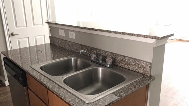 kitchen featuring dishwasher and sink