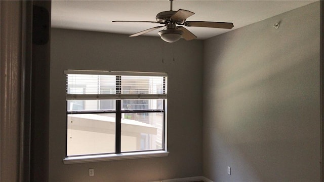 spare room with ceiling fan