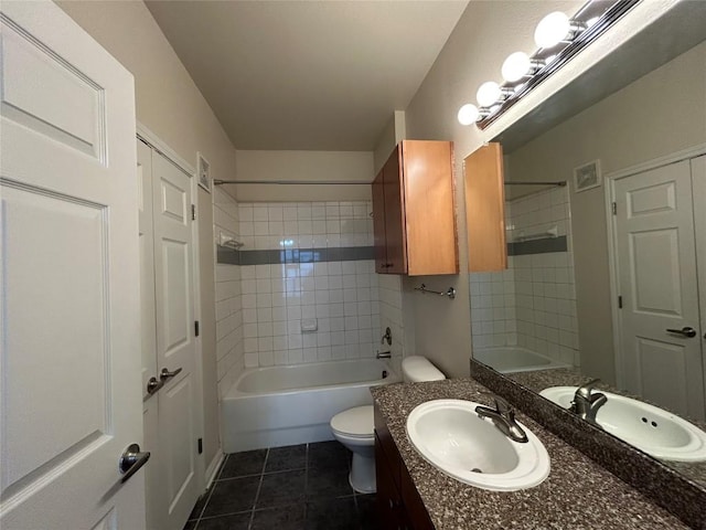 full bath featuring vanity, visible vents, tile patterned flooring, bathing tub / shower combination, and toilet