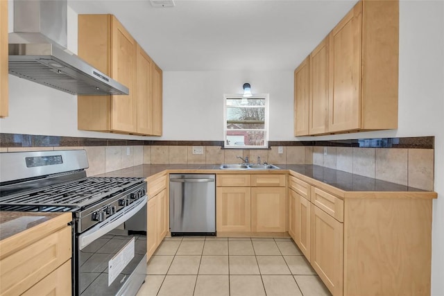 7209 Gunnison Pass, Austin, TX 78724 - kitchen featuring appliances with stainless steel finishes, wall chimney exhaust hood, light brown cabinets, a sink, and light tile patterned floors