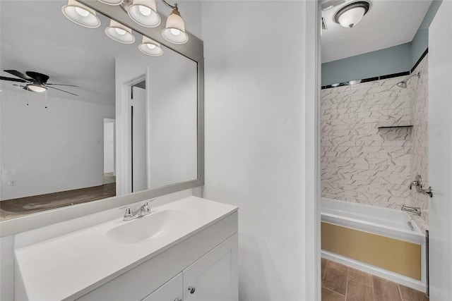 7209 Gunnison Pass, Austin, TX 78724 - bathroom featuring vanity, a ceiling fan, bathing tub / shower combination, and wood finished floors