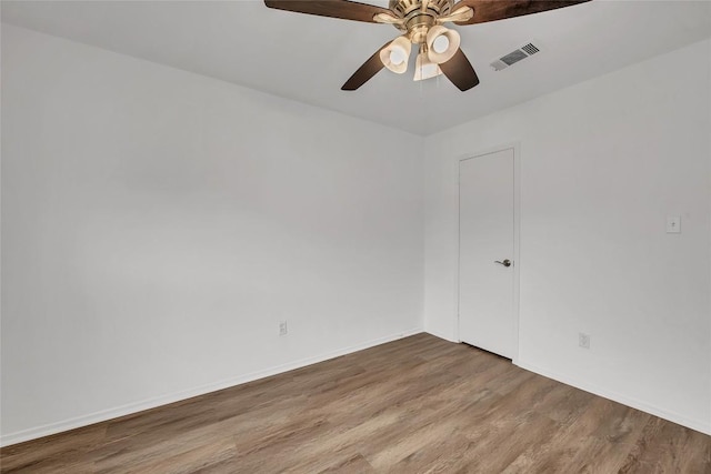7209 Gunnison Pass, Austin, TX 78724 - empty room featuring wood finished floors, ceiling fan, and baseboards