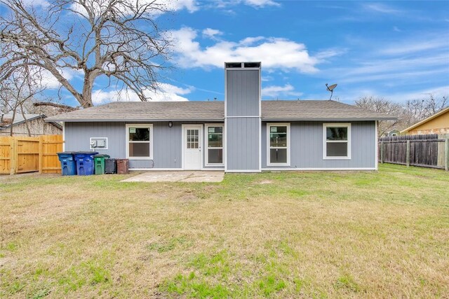 7209 Gunnison Pass, Austin, TX 78724 - rear view of property featuring a fenced backyard, a patio, roof with shingles, and a chimney