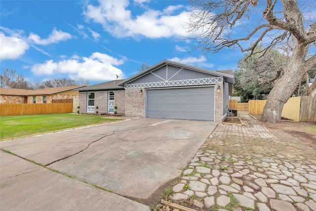 ranch-style house with a garage and a front lawn