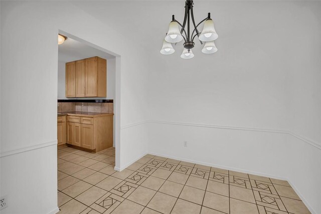 7209 Gunnison Pass, Austin, TX 78724 - unfurnished dining area featuring a chandelier and light tile patterned flooring
