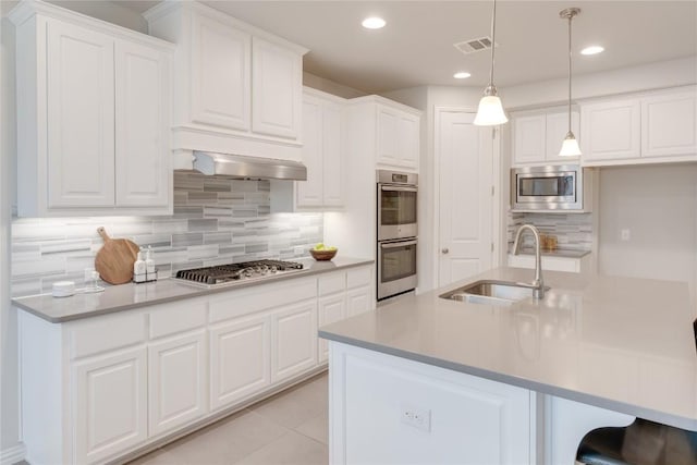 kitchen with white cabinets, stainless steel appliances, and sink