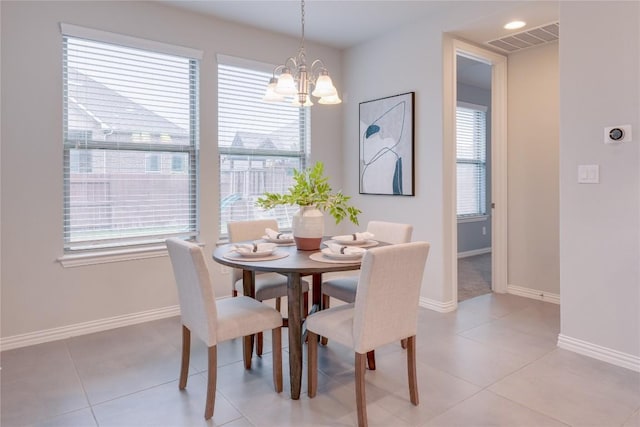 dining area featuring light tile patterned flooring and a healthy amount of sunlight