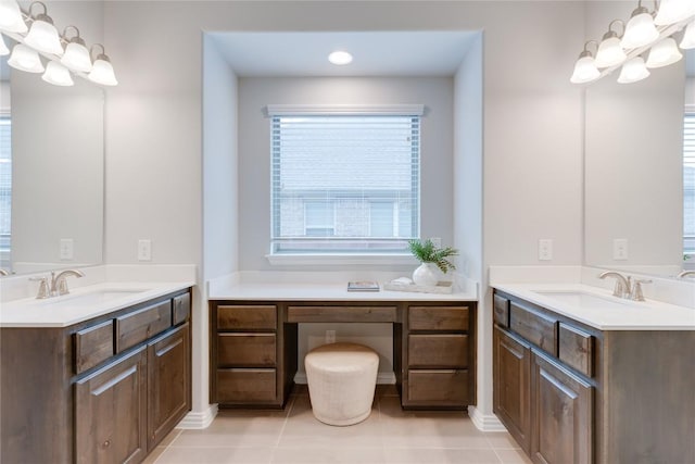 bathroom featuring tile patterned flooring and vanity