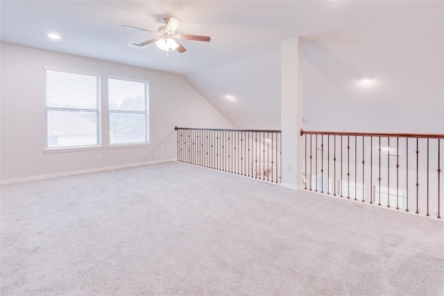 additional living space featuring light carpet, ceiling fan, and lofted ceiling