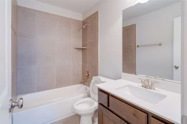 full bathroom with vanity, toilet, and tiled shower / bath combo