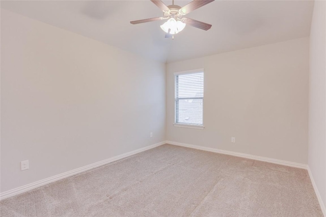 unfurnished room with light colored carpet and ceiling fan