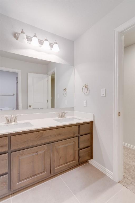 bathroom featuring tile patterned floors and vanity