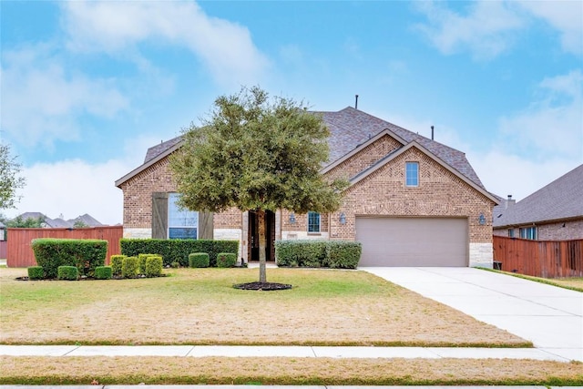 view of front facade featuring a front lawn and a garage