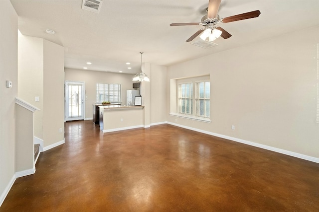 unfurnished living room with ceiling fan with notable chandelier