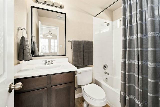 full bathroom featuring ceiling fan, shower / bath combination with curtain, toilet, and vanity