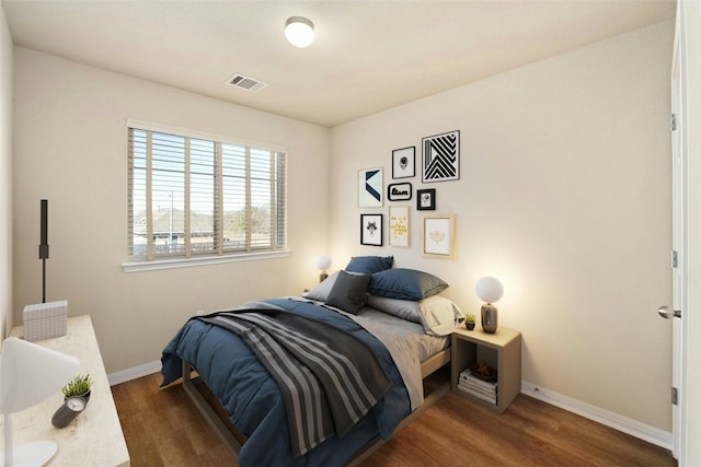 bedroom featuring dark hardwood / wood-style flooring