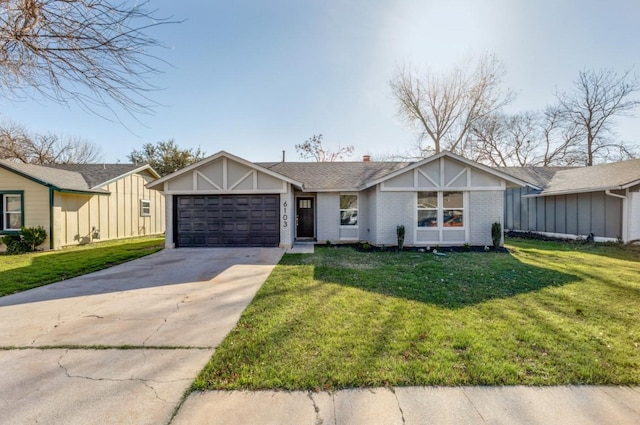 view of front facade with a front yard and a garage