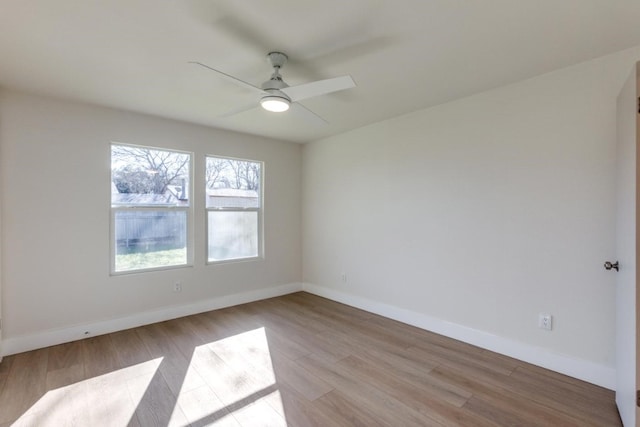 spare room featuring ceiling fan and light wood-type flooring