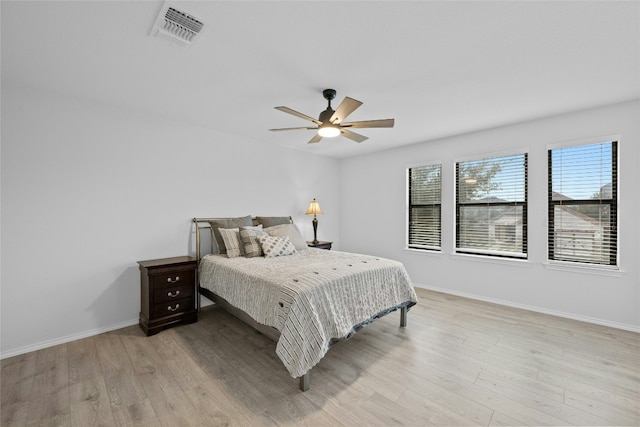 bedroom with light wood-type flooring and ceiling fan