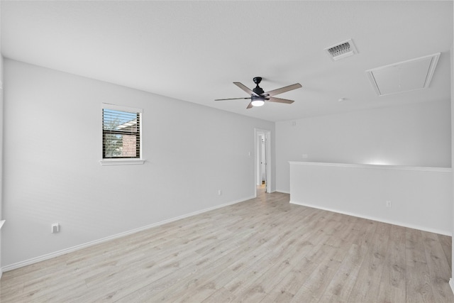 spare room featuring light hardwood / wood-style flooring and ceiling fan