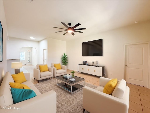 tiled living room with ceiling fan