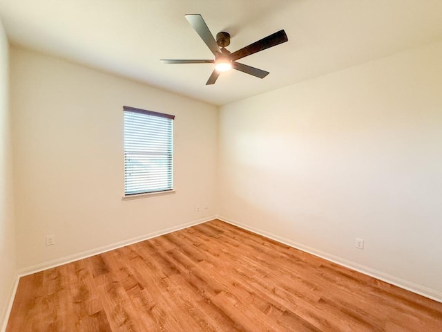 empty room with light hardwood / wood-style flooring and ceiling fan