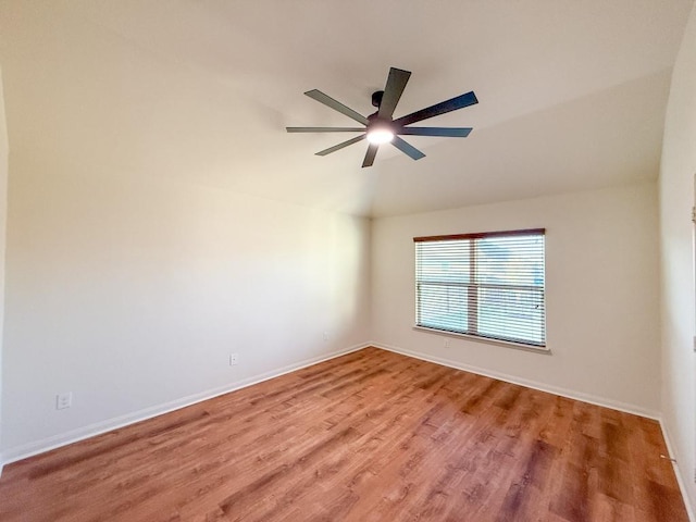 empty room featuring ceiling fan and hardwood / wood-style floors