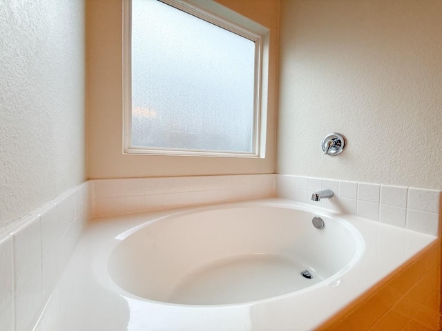 bathroom featuring a tub to relax in