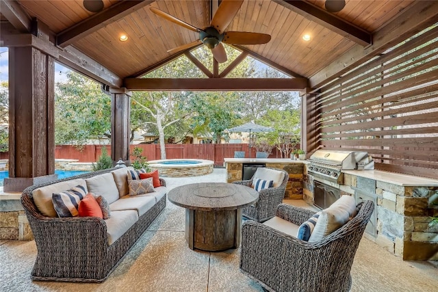 view of patio / terrace with an outdoor kitchen, area for grilling, an outdoor hangout area, and ceiling fan