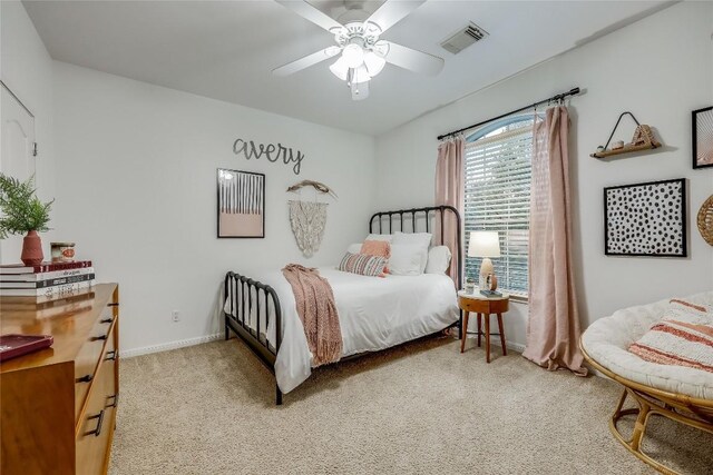 bedroom featuring ceiling fan and carpet