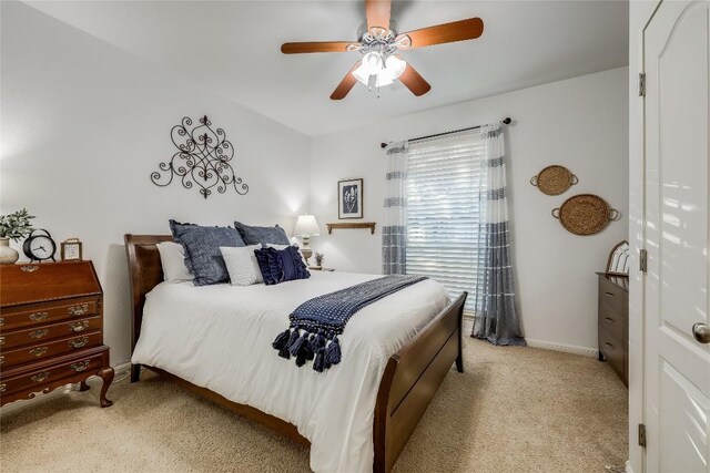 bedroom with light colored carpet and ceiling fan