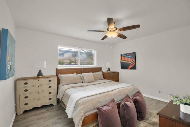 bedroom featuring hardwood / wood-style floors and ceiling fan