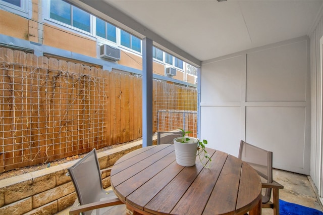 unfurnished dining area with a wall unit AC