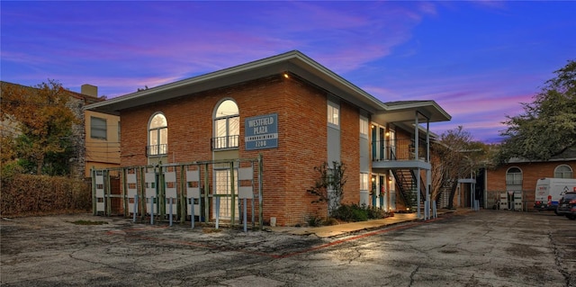 view of back house at dusk