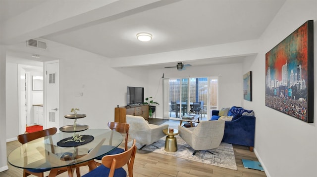 dining space featuring light hardwood / wood-style flooring and ceiling fan