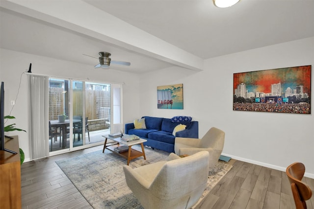 living room with beam ceiling, ceiling fan, and wood-type flooring