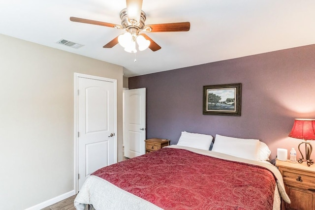 bedroom featuring hardwood / wood-style floors and ceiling fan