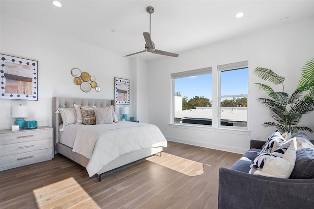 bedroom with ceiling fan and dark hardwood / wood-style flooring