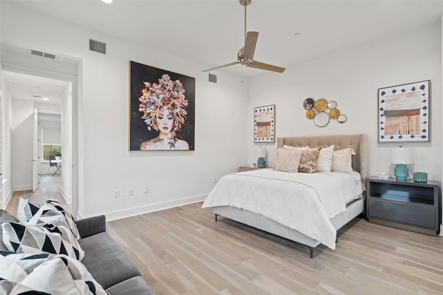 bedroom with light hardwood / wood-style floors and ceiling fan