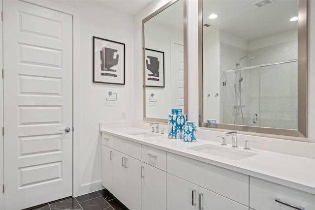 bathroom with tile patterned flooring, vanity, and a shower with shower door