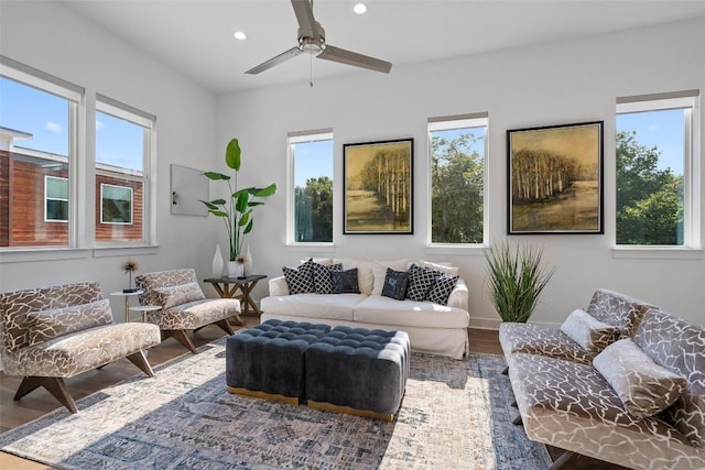 living room with hardwood / wood-style flooring and ceiling fan