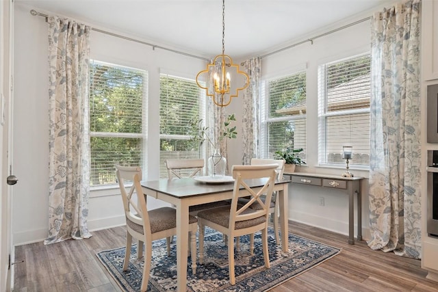 dining area featuring a chandelier and hardwood / wood-style flooring