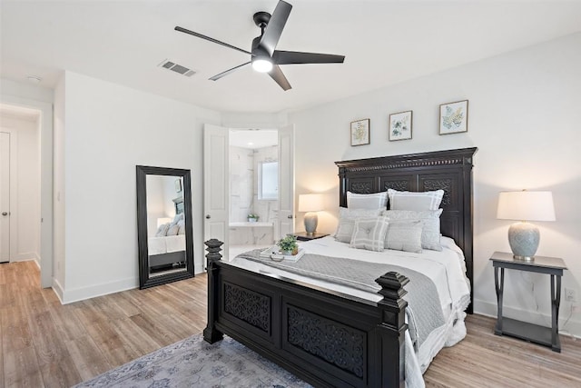 bedroom with light wood-type flooring, connected bathroom, and ceiling fan