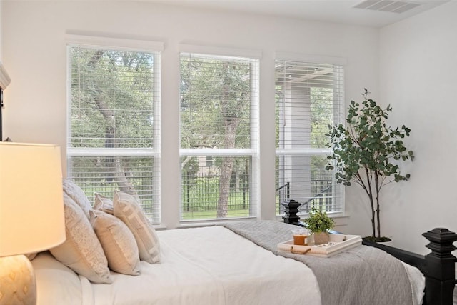 bedroom with multiple windows